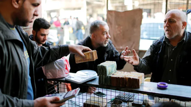2020-12-20T103925Z_813416941_RC2YQK9OT3H4_RTRMADP_3_IRAQ-CURRENCY.jpg